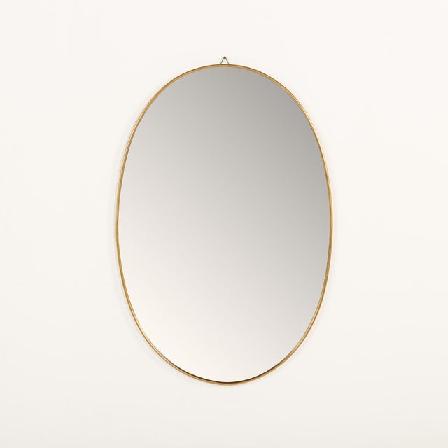 This elegant, full size Italian mid-century mirror in a brass frame from the 1950s is a striking example of minimalist...