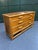 Beautiful vintage bamboo and rattan six-drawer dresser featuring a warm honey-toned finish, sculptural bamboo...
