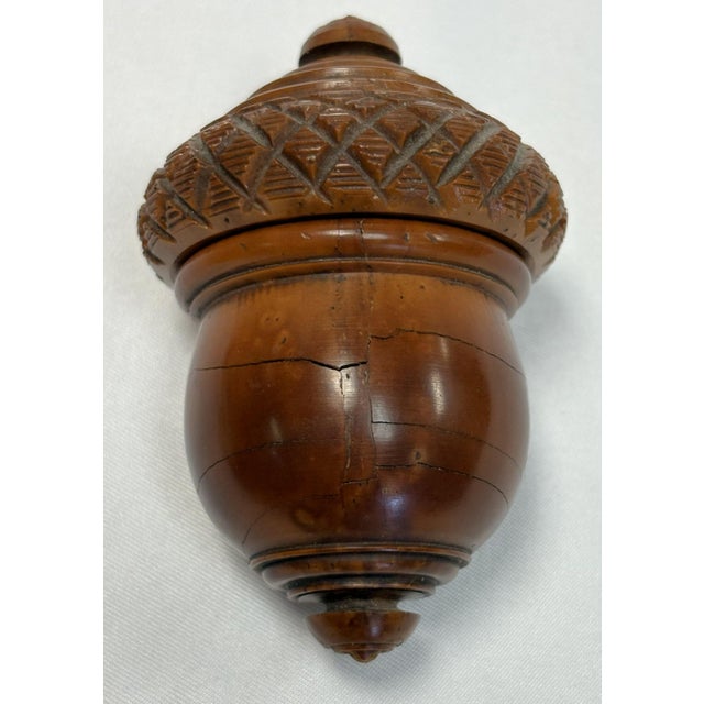 Such a rare piece. This is a handmade wood spice grater from the 19th century. It has a wonderful acorn shape with a...