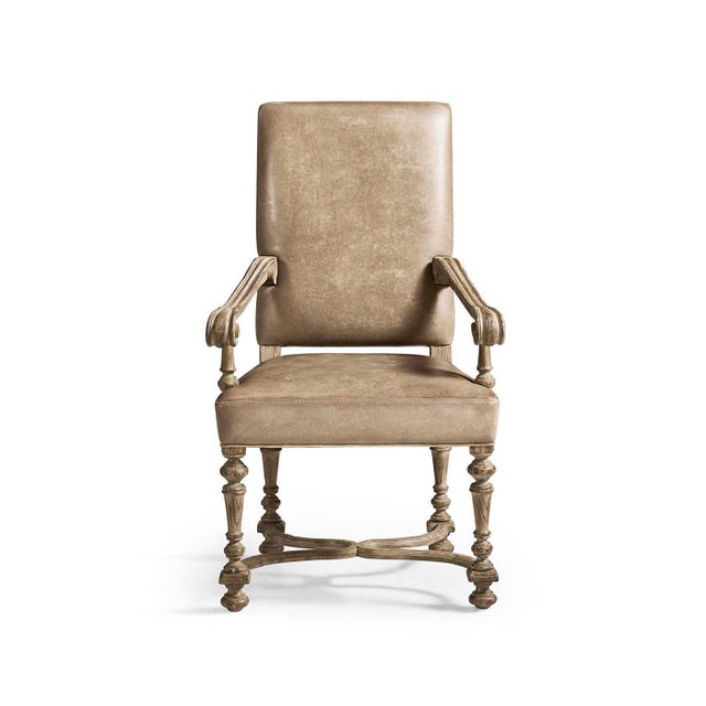 The upholstered armchair shows the elegant style of Baroque design with its tall, straight back, balanced shape, and...
