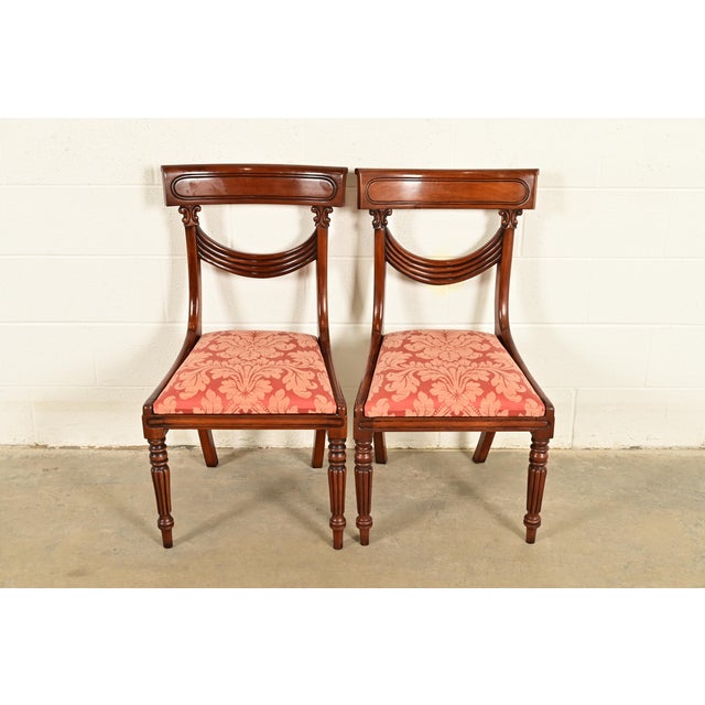 A gorgeous pair of Italian Provincial or English Regency style side chairs or dining chairs In the manner of Baker...