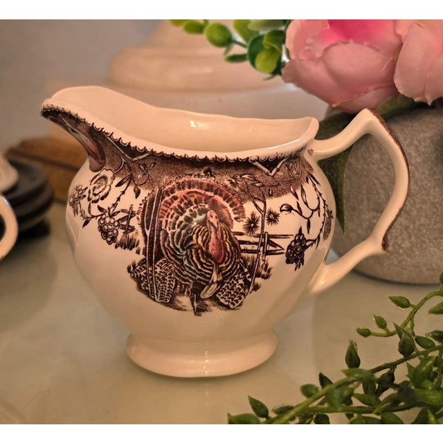 Vintage Johnson Brothers "His Majesty" creamer pitcher. Featuring a colorful center turkey and a pattern of festive fall...