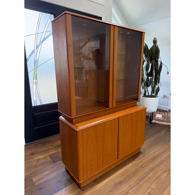 An exceptional Danish Modern style teak hutch and sideboard by Nordic Furniture of Markdale, Ontario, Canada. This...