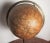 Celestial Globe with brass meridian on brass base. 13" wide at meridian.