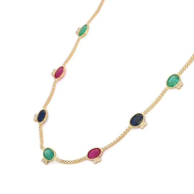 This is part of Chairish’s Fine Jewelry assortment. Multi Gemstone Necklace in 18K Gold studded with octagon cut emerald,...