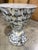This lovely table is textured to perfection, with a top surface of hand-laid petrified clam stone and a stylish, hour-...