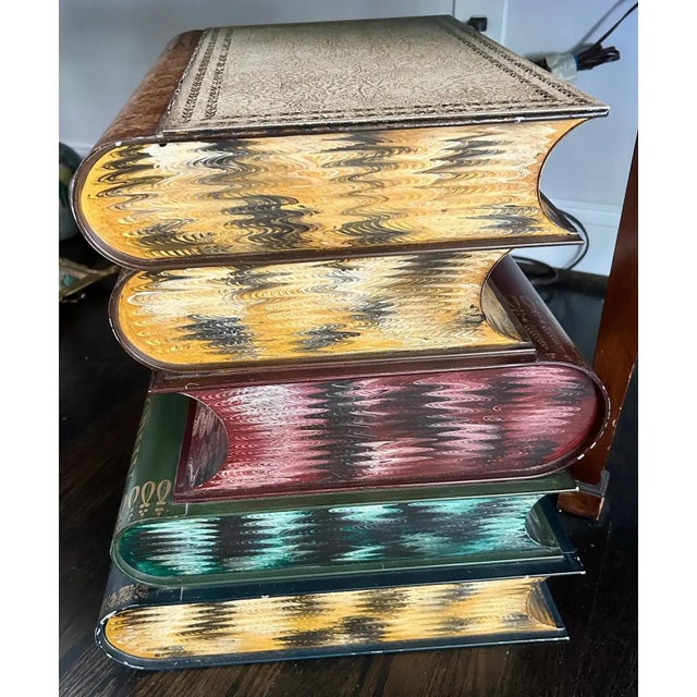Indulge in the beauty of this Vintage Italian Tole Book Table, featuring a stunning Trompe l'Oeil book stack design. This...