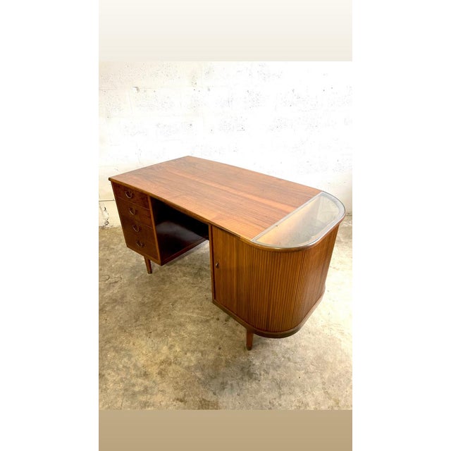 Danish Modern Desk with Side Bar. Tambour door on one side. Finished back. 55w 28d 29.5