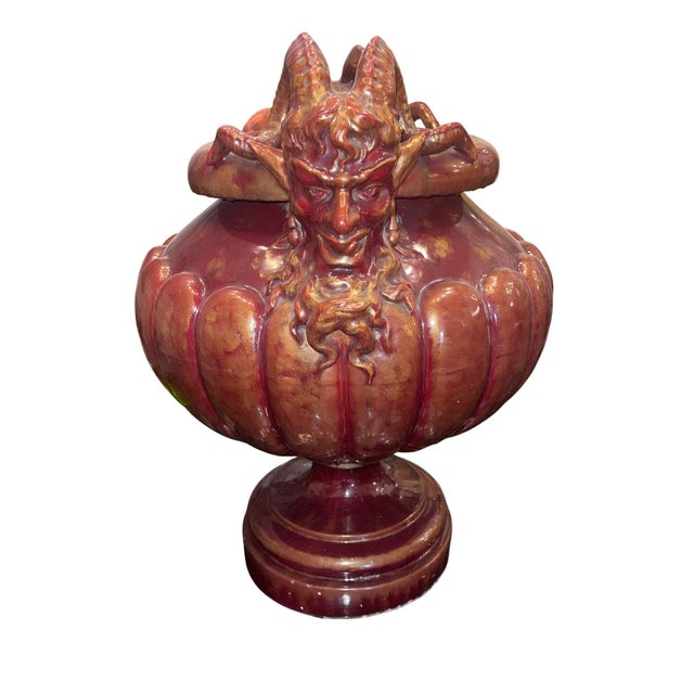 An imposing Continental Italian glazed terracotta earthenware jardinière from the Early 20th century, with striking and...