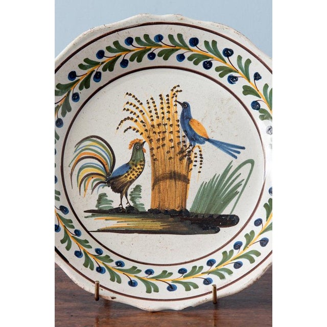 Diameter: 23 cm Height: 3 cm Some wear throughout, commensurate with age. Minor chips under the edge.