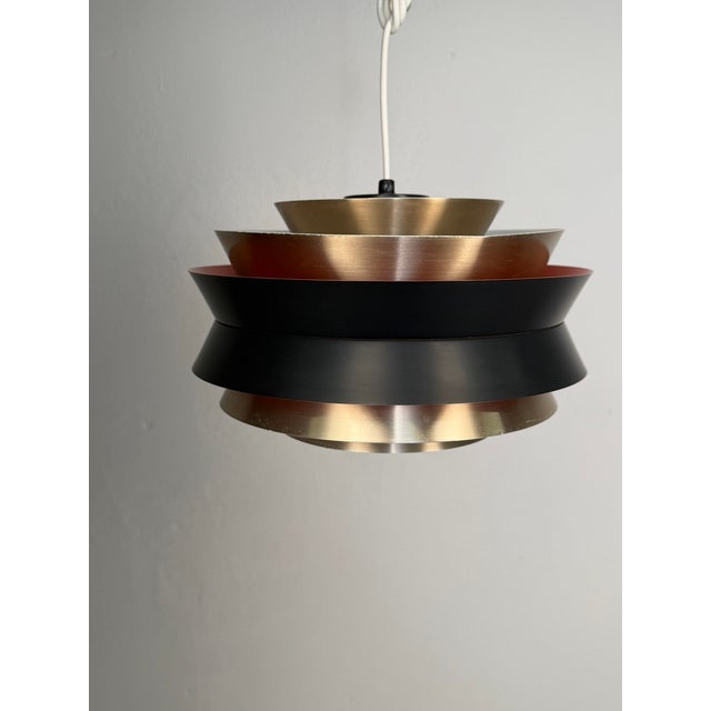 Original “Trava” pendant lamp designed by Carl Thore for Granhaga Metallindustri, Sweden. One of the most recognisable...