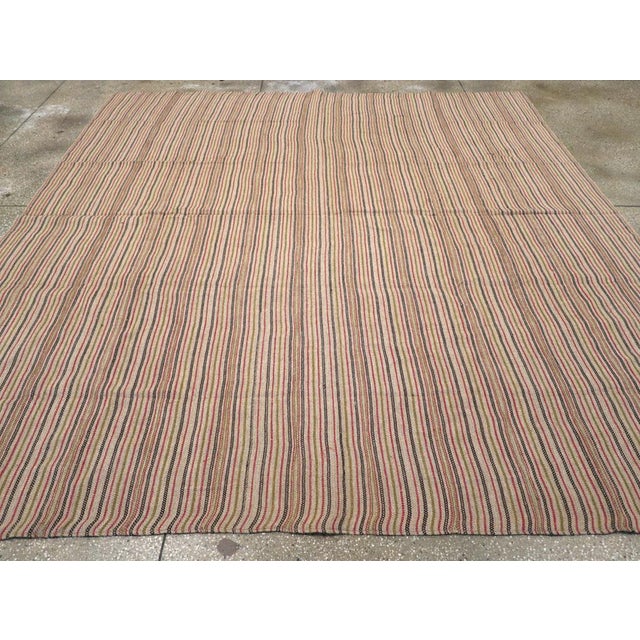 A vintage Turkish flatweave Kilim square room size carpet handmade during the mid-20th century. Measures: 9' 6" x 10' 0"