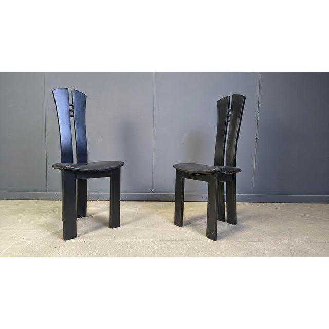 Vintage design dining chairs with black wooden frames and black faux leather seats. Postmodern design. 1980s - Italy Good...