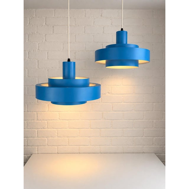Matching pair of Equator pendant lamps designed by Jo Hammerborg for Danish manufacturer Fog & Mørup in 1968. The...