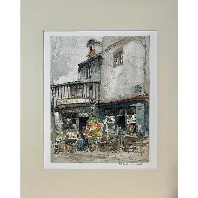 A beautiful original hand colored etching of a small Paris Fruit Market located at 77 Rue Galande circa 1930 by Franz...