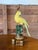 Pair of vintage Jeanne Reed figural porcelain parrot table lamps, beautifully hand-painted in vibrant yellow with green...