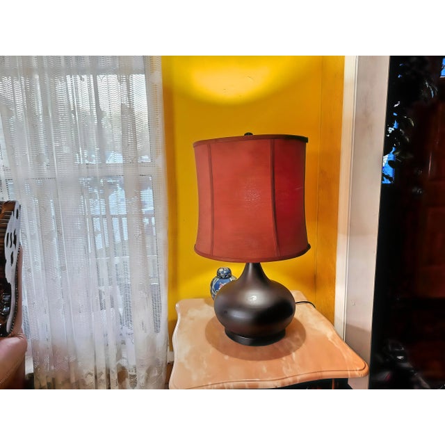 If you are looking bring some artistic style to your living space, this transitional onion shaped metal table lamp in...