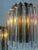 Step into a world of refined elegance with these smoked and transparent Italian glass wall sconces. Each piece is a...