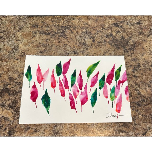 Bold strokes of crimson and emerald leaves create a striking display of natural rhythm and balance.