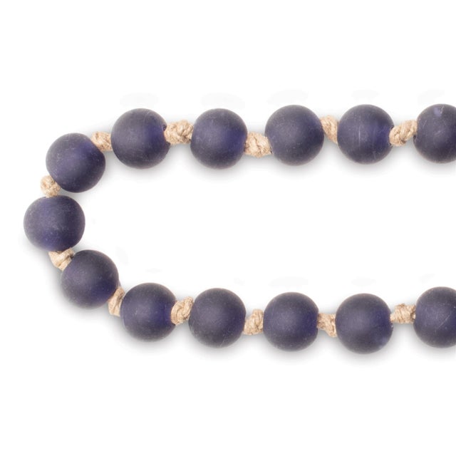 Bring a touch of winter elegance to your holiday decor with the Frosted Glass Bead Garland. Featuring cool blue and grey...