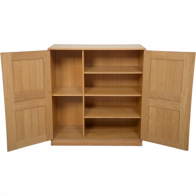 Mogens Koch cabinet made of oak, and from the 1980s. The cabinet appears with some marks and scratches. •Designer: Mogens...