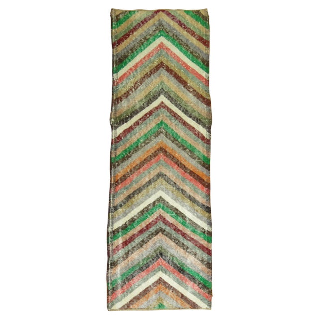 A colorful mid-20th century shabby chic Turkish runner. Measures: 1'9” x 5'7”.
