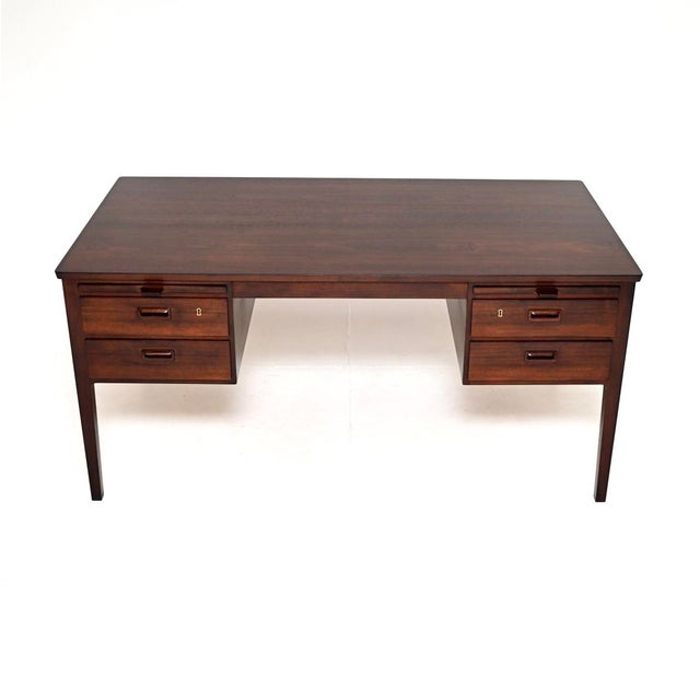 An exceptionally well made and large vintage Danish cabinetmaker executive desk. This was made in Denmark by Henning...