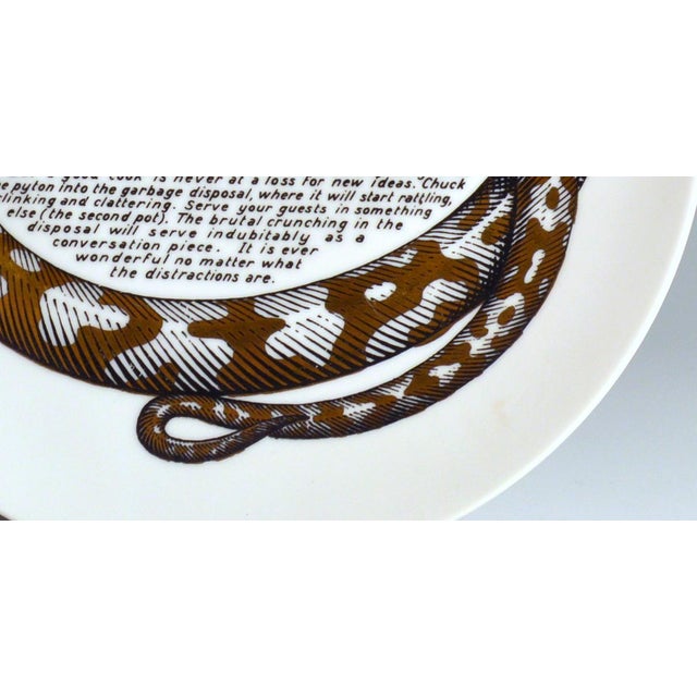 Fornasetti Fleming Joffe Recipe Plate, Python a l’Orange Italy, 1967–1974 A python winds twice around this plate in black...