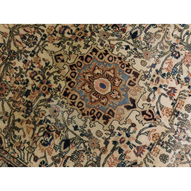 Vintage Persian rug. Wool pile on cotton foundation. Hand made. Central medallion surrounded by floral decoration on an...