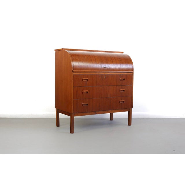 About mid century Danish modern roll top secretary teak desk attributed to Egon Ostergaard. This is truly a stunning...