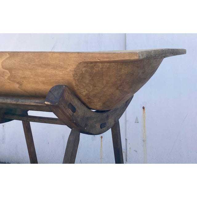 Our European vintage and antique wooden dough bowls or trogs are hand-hewn from whole split logs. They all feature...