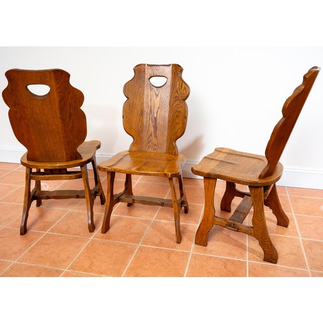 A magnificent, attention-grabbing and very rare set of six sculptural tiger oak Mid Century dining chairs in really lovely...