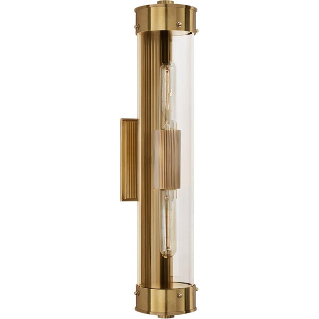 Marais Linear Bath Sconce in Hand-Rubbed Antique Brass with Clear Glass Designer: Thomas O'Brien Height: 21" Extension:...