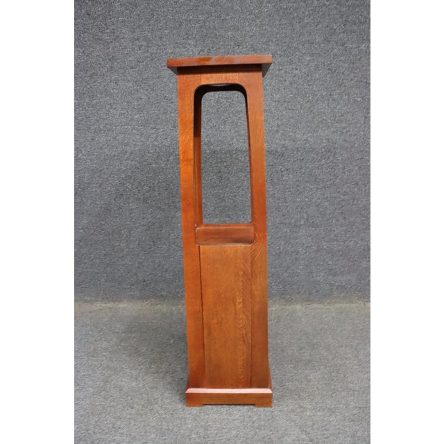 Authentic Stickley quarter sawn oak lighted display pedestal featuring a clean Arts & Crafts design with an illuminated...