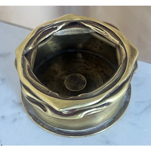 Ash tray or catch all trench art piece made in France. The casing is stamped 1906 but was likely made into the container...