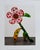 Elevate your space with this striking art print featuring Yayoi Kusama’s&nbsp;Flowers That Speak All about My Heart Given...