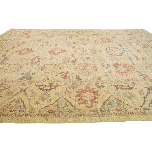 Beautiful modern Sultanabad hand-knotted wool rug with a blue color field. This rug has a designed frame with rust-orange...
