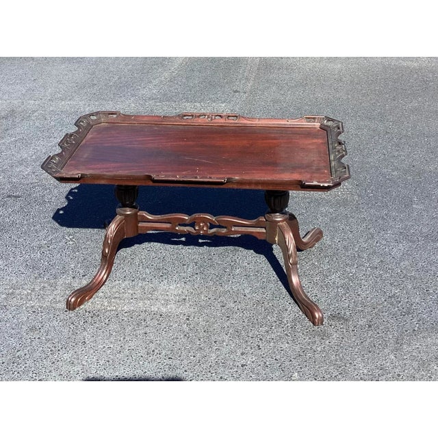 This fantastic antique Table features wood carvings etched in. From the beautiful mahogany top with solid, hand carved...