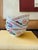A colorful set of three vintage Chinese porcelain bowls featuring a lively fish and lotus flower design in vibrant...