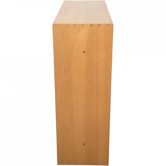 Mogens Koch bookcase made of oak. The bookcase is from the 1980s and appears with some marks and scratches. •Designer:...