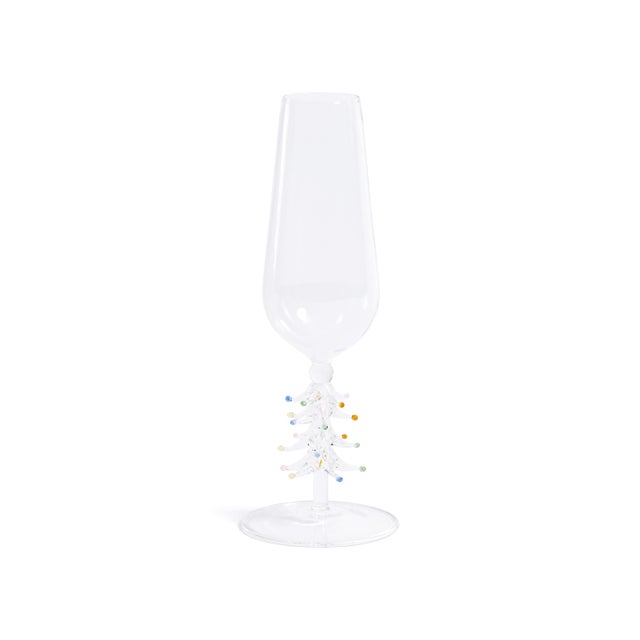Toast the season in style with this festive set of four champagne flutes, each featuring a whimsical holiday tree detail...