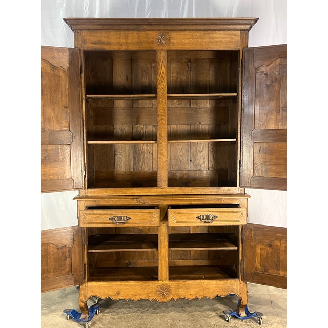 Antique Country French Provincial buffet deux corps crafted from oak, featuring two upper doors and two lower doors with...