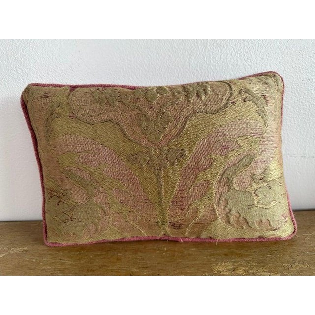 Vintage textile pillow crafted from a beautifully aged decorative fabric featuring an abstract, organic motif in soft...