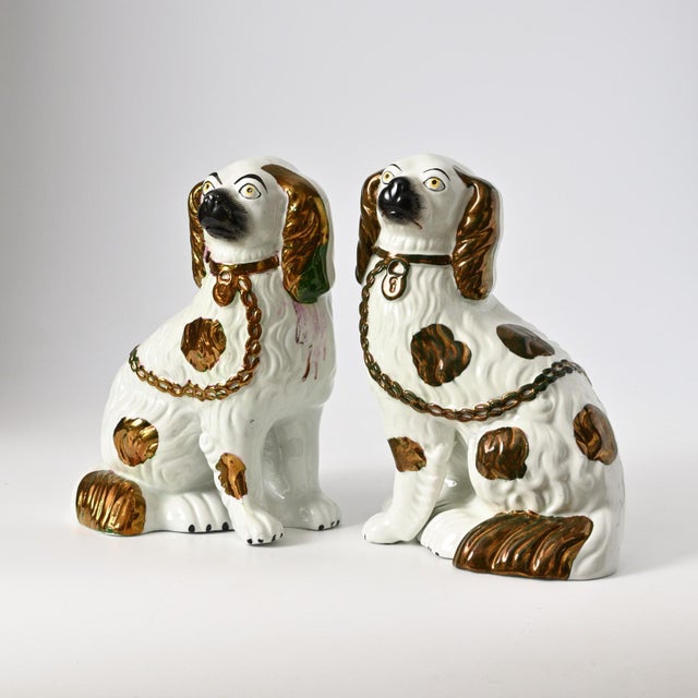 Pair of 19th century Staffordshire mantle dog figurines.