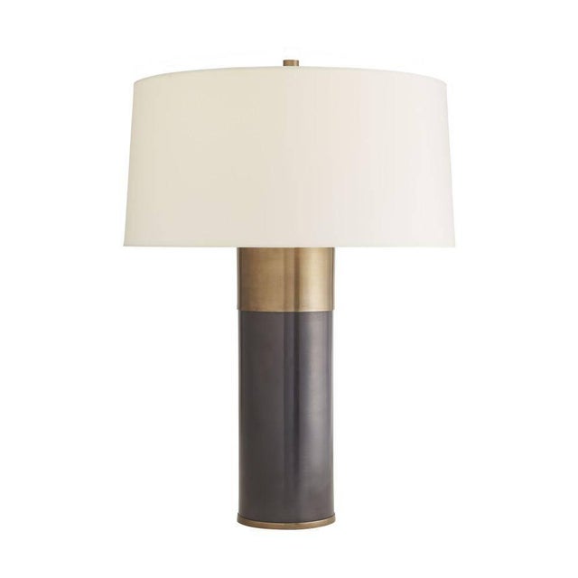 Sleek. Simple. Sophisticated. The classic form of this quintessential aluminum column lamp is updated with a thick antique...