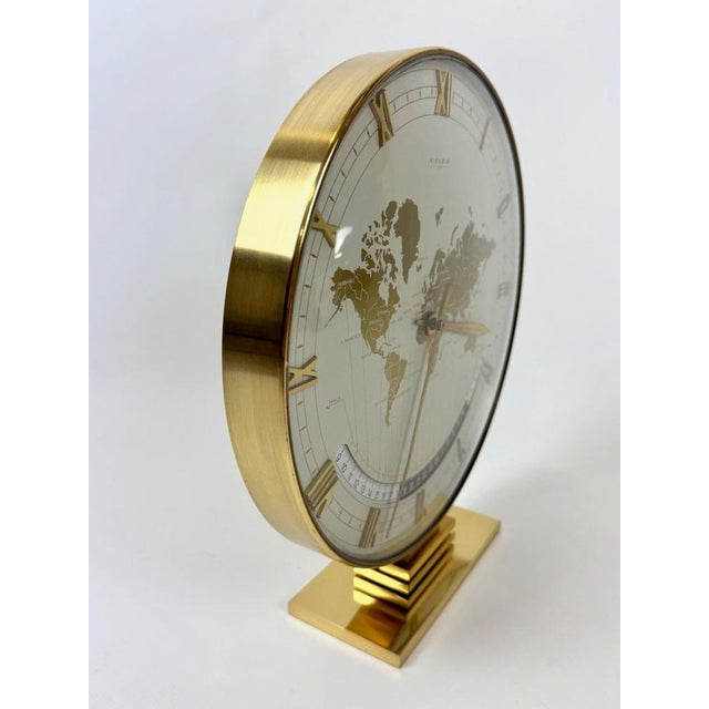 Large World Time Clock by Heinrich Möller for Kienzle, 1960s, in Restored conditions. Designed 1960 to 1969 This piece has...