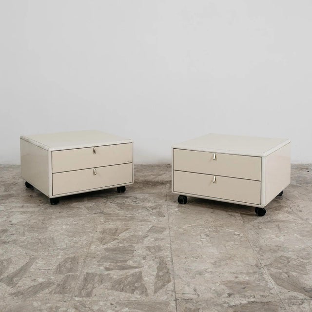 An exceptional pair of bedside tables from the prestigious "hennè" series, designed by acclaimed designer george coslin...
