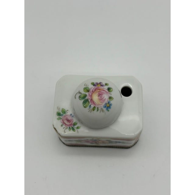 This antique Limoges porcelain inkwell dates to the early-to-mid 20th century and features beautifully hand-painted roses...