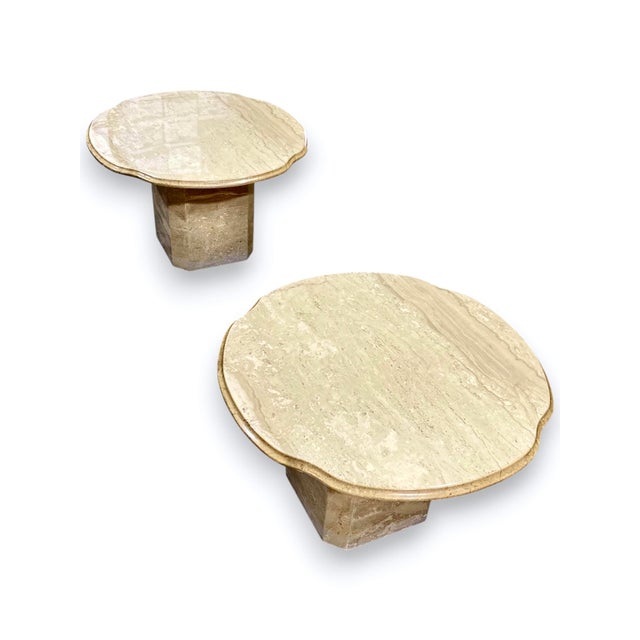 Infuse your space with earthy elegance and sculptural presence through this pair of 1970s Italian travertine scalloped...