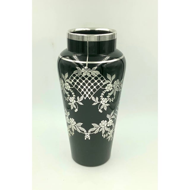 Elegant with sterling silver overlay black glass vase featuring a lattice flowers and leaves design. With a sterling rim...